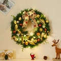 Lighted Christmas wreath with red ornaments and a festive bow on a beige wall - Style C Wreath With LED Lights