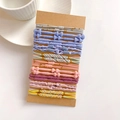 Detailed view of ten colorful elastic hair ties with gold beads on a brown card - Concentric Buckle Style C Set