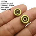 Detail view of 12mm bronze wheel spacer beads with measurements on fingers - No. 8 Round Ring (12mm Dia/3.2mm Thick)