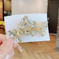 Elegant gold double butterfly hair clip with clear crystals for women's hairstyling - White