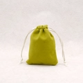 Detail of lime green velvet drawstring pouch showing soft texture and white cords - Avocado Green