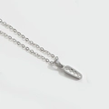 Minimalist silver initial necklace with geometric textured pendant on white background - Letter I / Silver