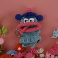 Blue handmade crochet monster key pouch with large pink lips and purple ears - Squinty Eye Girl