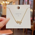 Collana in acciaio al titanio dorato con doppio ciondolo a fiore di diamanti su cartoncino - Stile Fiore con Doppia Zirconia (X585) / Oro