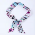 Blue and magenta geometric print satin skinny scarf tied in a bow on white background - X23-Multi