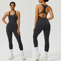 Deep grey racerback yoga bodysuit with open back design and tight fit silhouette - Charcoal Grey