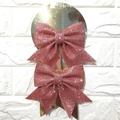 Set of two pink glitter bow holiday hair clips on a golden display card stand - Pink Small Bows 2Pcs