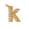 Macro detail of gold letter K charm with micro-pave white crystals and a top bail - Letter K / Gold