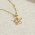 Macro view of gold butterfly pendant with sparkling cubic zirconia on a cable chain - Marquise Butterfly / 14K Gold
