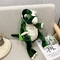 Cute green triceratops dinosaur plush backpack with adjustable straps on a sofa - Green Triceratops