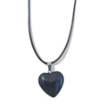 Macro shot of 20mm heart-shaped black stone pendant with polished finish and silver bail - 20mm Pendant + 40cm Leather Cord / Black Stone