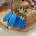 Detail of bohemian drop earrings with blue feathers, vintage metal base and beads - Dark Blue Feather Wood Bead Style
