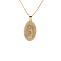 Detailed macro view of gold oval pendant featuring religious relief and pavé zircon stones - Oval Pendant-Thin Chain / Gold-Religious Relief