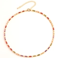 Close-up of golden necklace featuring colorful rectangular gemstones and lobster clasp - Multicolor Necklace
