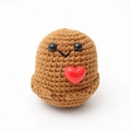 Macro detail of hand-knitted brown potato doll with a small red heart and soft wool texture - Dark Brown V-Mouth With Acrylic Heart