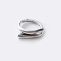 Close-up of silver open ring with twisted design and vintage textured metal surface - Twisted Texture Style / Adjustable Open