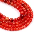 Macro shot of red agate round beads with unique dragon vein patterns and crackle finish - Red Dragon Veins Agate