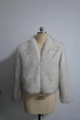 Detail showing the thick texture and fluffy white faux fox fur on this short jacket - S / White Dyed Tipped