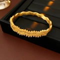 Textured gold wavy bangle with shimmering inlaid crystals on a black display stand - 8# Bracelet-Gold-Wave Texture Inlaid Diamond Style