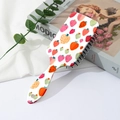 Detail shot of strawberry print cartoon air cushion hairbrush on white background - Style B-Red Strawberry