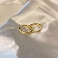 Detailed view of elegant gold pearl earrings on luxurious white silk fabric background - Minimalist Hoop (E5209 Gold)