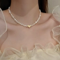 Close-up of pearl necklace with baroque pearls and textured gold heart pendant on neck - 35# Necklace - Gold Heart Baroque Irregular Pearl