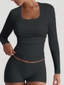 Detail view of dark gray rib-knit yoga top with square neckline and slim fit design - Gray