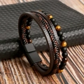 Detail of men's multilayer bracelet with tiger eye beads and leather on jewelry box - 21cm / Coffee