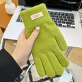 Detail of green knitted gloves with fashion logo patch on soft thickened wool material - Open Finger Candy Color Green