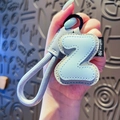 Light blue faux leather letter Z keychain with matching braided strap and black metal ring - Letter Z