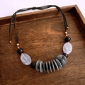 Detail view of double-layer beaded necklace with black wax rope and shell pearls - Transparent Gray