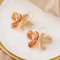 Vintage floral pearl drop earrings in amber and beige tones on a white silk background - Amber & Cream White Flower