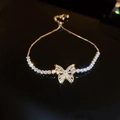 Detail of adjustable gold butterfly bracelet featuring sparkling zircon butterfly pendant - Gold Butterfly Zircon Bracelet