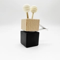 Car air vent perfume clip with black ceramic cube and wooden sticks on white background - Matte Black / Blank Style