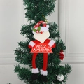 Weihnachtsmann-Filzanhänger mit Feliz Navidad Schild am grünen Weihnachtsbaum - Weihnachtsanhänger Weihnachtsmann