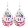 Detail of tear-drop leather earrings with 'First Grade' print and pink glitter layer - First Grade