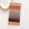 Close-up of assorted high-elastic hair ties in various colors on display cards - Bamboo Texture Korean Style Set