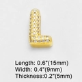 Macro shot of gold-plated cubic zirconia letter L charm with 15mm length and 5mm thickness - L