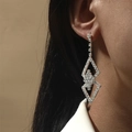 Elegant silver geometric rhombus earrings with sparkling crystals worn by a model - Silver Geometric Rhombus Rhinestone Style (DTE1616023S)