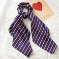 Blue satin scrunchie with long ribbons featuring red and white stripes on white fabric - Navy Striped