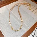 Vintage-Perlenkette mit Champagner-Kristallen und Muschelimitat-Perlen - Champagner Katzenaugen-Perlen-Stil / Aprikose