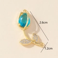 Ciondolo tulipano dorato con gemma blu e strass, dimensioni di 2,6cm per 1,2cm - Blu