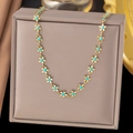 Detail of golden flower link necklace with turquoise centers on luxury gift box - Blue Gemstone Flower Style (H172) / Gold