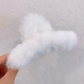 Plush white faux fur hair claw clip for elegant buns with a soft fuzzy texture - White