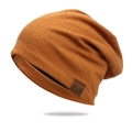 Slouchy knit beanie in caramel orange with F&S leather patch for sports and street style - Turmeric