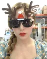 Close-up of Christmas party glasses featuring festive brown antlers and a red Santa hat - Large Antlers