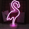 Neon pink flamingo LED light with white circular base for festive table decoration - Pink Flamingo