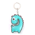 Detail of teal leather dinosaur keychain with pink dots and sturdy metal keyring - Dinosaur