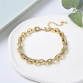Macro shot of gold chain bracelet with zircon micro-pave details and lobster clasp - Gold Chain With Rhinestone Style (JSS220014A)