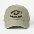 Detailed close-up of embroidered SUPPORT DAY DRINKING text on washed olive cotton cap - One Size / Light Khaki
